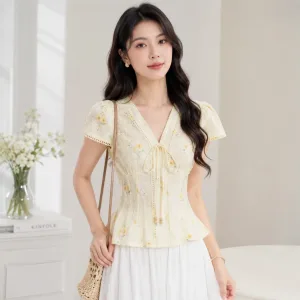 Áo kiểu nữ tơ dập in hoa cổ V thắt nơ